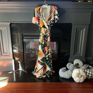 Full wrap dress lined. Large tropical print. Flutter short sleeve.